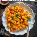 Patates Kavurma, a Turkish potato dish with onion, tomato paste, and spices, served on a white plate and topped with parsley.