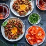 Pinterest pin image showing ground beef and eggs breakfast served on plates with tomatoes, olives, and Turkish tea, with recipe title text overlay.