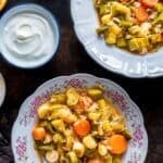 Vertical image titled “Turkish Leeks Zeytinyağlı Pırasa” featuring braised leeks and carrots on floral plates, with yogurt and citrus slices on a dark background and Giverecipe.com at the bottom.