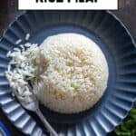 Pinterest-style image of Turkish rice pilaf shaped into a dome on a dark plate with the text “Turkish Rice Pilaf” overlaid at the top.